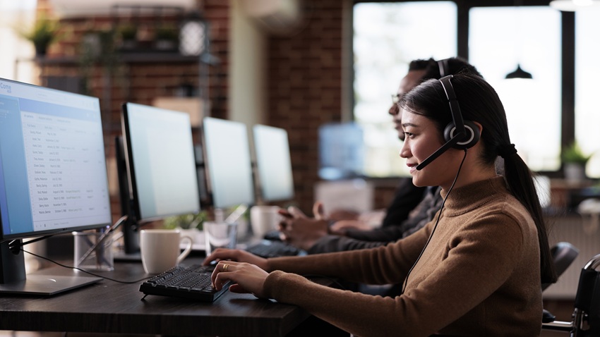 Home paralyzed asian employee working at call center reception